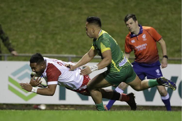 'Ikale Tahi's Paula Mahe scores over Cook Islands during RWC2023 Asia / Pacific Qualifier in Pukekohe July 2021